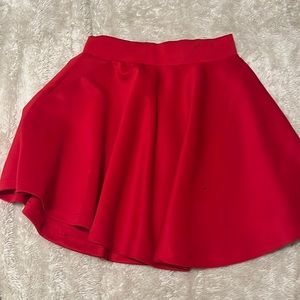 Medium red flowy skirt. No stains rips or imperfections